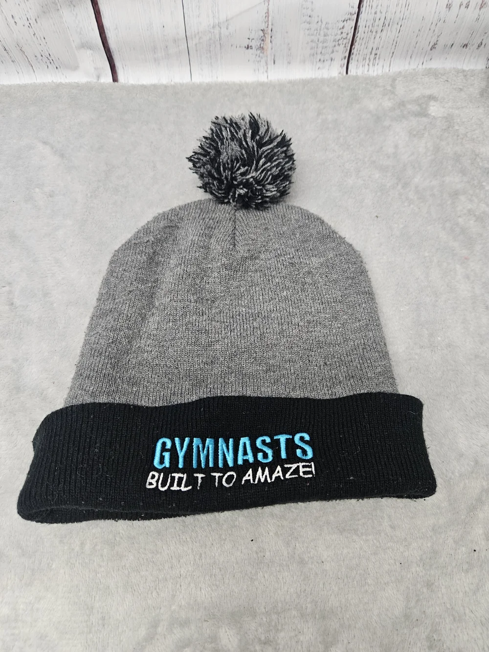Gymnasts Built to Amaze Gray & Black Pom Beanie